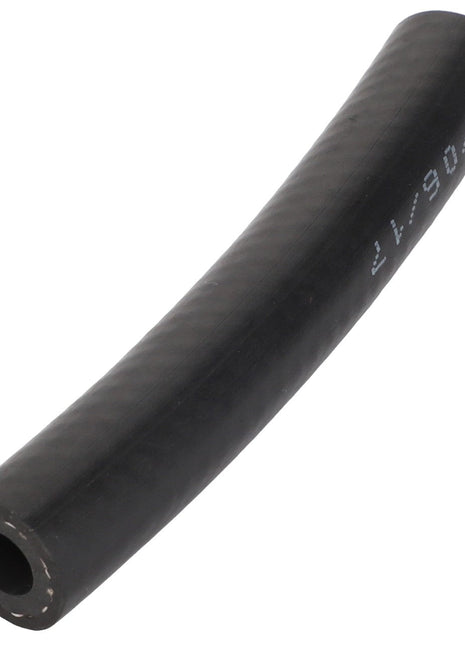 The AGCO Hose - Acp0329060, a durable black rubber hose with white markings, is elegantly displayed against a clean white background. Slightly curved, it reveals a hollow center that enhances its flexible design.