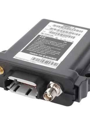 The AGCO CONTROL UNIT - ACZ0001630 is a sleek black electronic device that features multiple ports, including a coaxial connector and two additional smaller connectors. Its surface is adorned with labels and barcodes.