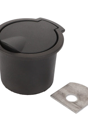 A product labeled "AGCO | Ashtray - Acw0791880," featuring a black plastic recessed desk grommet with a hinged cover, is displayed alongside a flat, silver metal plate with a circular hole. No additional product description information is available for further details.