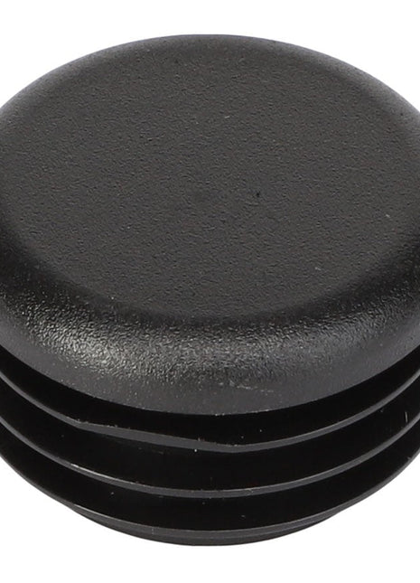 The AGCO | CAP - AG059020 is a black plastic end cap with a round top and ribbed sides, designed for enclosing the end of a cylindrical tube. Brand: AGCO. No current product description information is available.