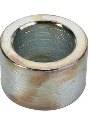 A slightly worn AGCO BUSH - D49060079, metallic cylindrical bushing with a hollow center and a rustic charm.