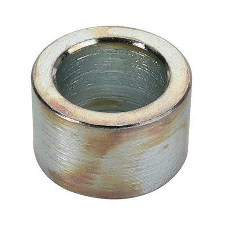 A slightly worn AGCO BUSH - D49060079, metallic cylindrical bushing with a hollow center and a rustic charm.