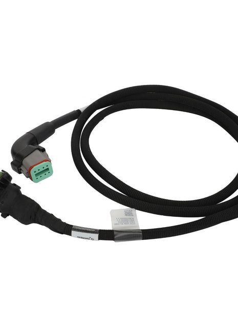 The AGCO Jumper Harness - Acw1390660 is a black automotive electrical cable featuring a connector on one end and a distinctive green and gray plug on the other end, neatly coiled in a loop.