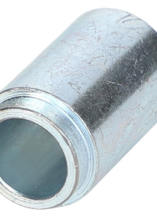 Close-up of the AGCO | SPACER - AL5215227, a cylindrical metal connector with a threaded end and a hollow interior, used for joining pipes or similar components.