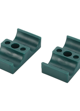 Two AGCO CLAMP - D45730013 green plastic mounting brackets with grooved cylindrical slots and multiple screw holes, displayed side by side on a white background. No current product description information is available for further details.