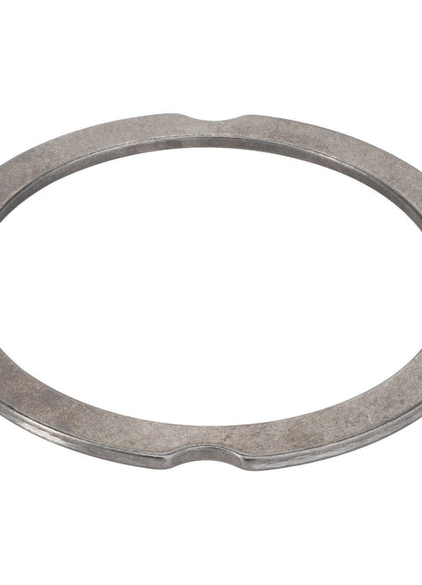 The AGCO | Compensating Ring - F007200210370 is a flat, circular metal ring with a smooth surface and small notches on its inner edge, making it ideal for precision fittings.