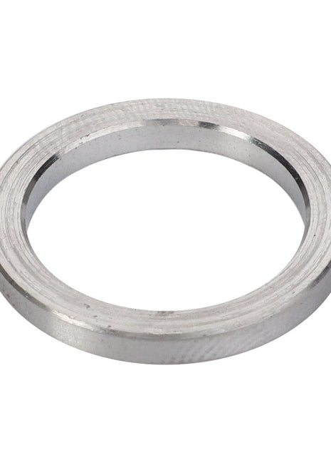 A close-up image of the AGCO | Disc - F119200710370, a circular metallic washer with a central hole and a slightly textured finish.