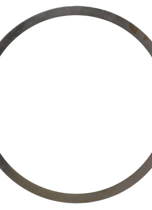 The AGCO | Shim - Acv0799500 by AGCO is a metal ring featuring a thin circular shape, with slight tarnishing in some areas.