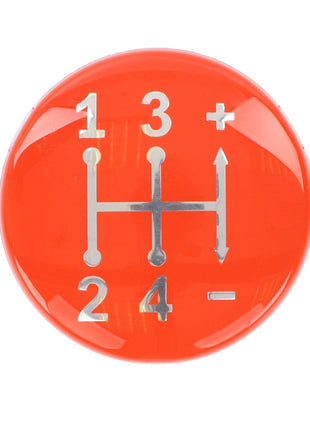 The AGCO Cap, Controls & Levers - 3821980M1 is a red gear shift knob featuring a diagram of a four-speed manual transmission pattern, numbered 1 through 4 with plus and minus symbols, designed for use with Massey Ferguson Models.