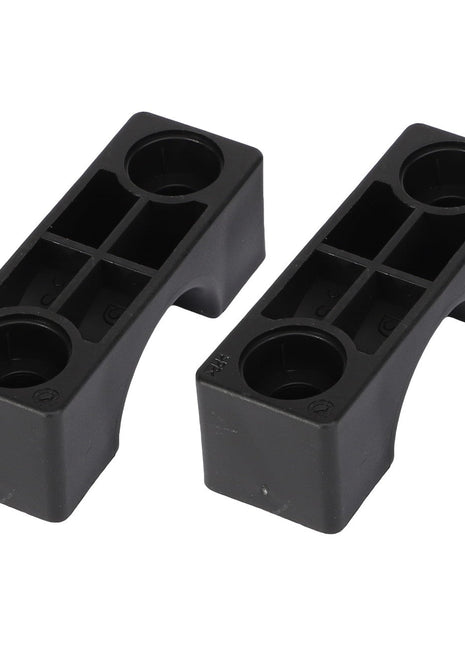 The AGCO Clamp - Acx2589650 consists of two rectangular black plastic blocks, featuring both circular and square compartments. No additional product description information is available at this time.