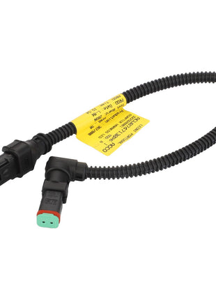 The AGCO Wire Harness Adapter - Acw0747130 is a black, coiled automotive wiring harness featuring connectors at each end and a yellow identification label for seamless integration and easy installation.