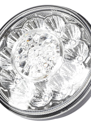 Close-up of the AGCO | Lamp - Acw1518740, a round, clear LED light with multiple bulb components arranged in a circular pattern, shining brightly.