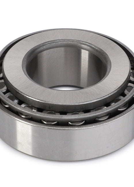 AGCO's Taper Roller Bearing - F930301020270 features an outer metal ring and inner cylindrical rollers, engineered to handle heavy-duty radial and thrust loads.