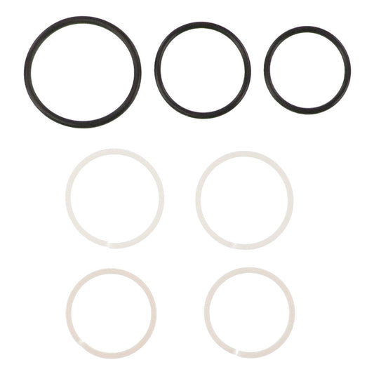 Six rubber O-rings from the AGCO SEAL KIT - AG121390 are arranged in two rows. The top row has three black O-rings in decreasing sizes from left to right, while the bottom row features three white O-rings, identical in size. No available product description information highlights the simplicity and uniformity of this design from AGCO.