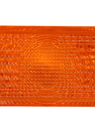 The AGCO | LENS - AG060003 is an orange rectangular reflector with a textured surface and a circular pattern in the center.