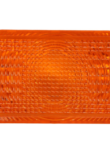 The AGCO | LENS - AG060003 is an orange rectangular reflector with a textured surface and a circular pattern in the center.