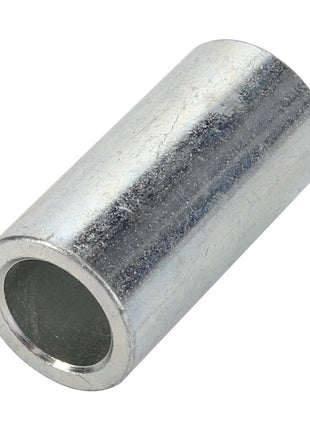 A close-up of the AGCO | SPACER - AL5220271, a cylindrical metal sleeve with a hollow center and smooth surface.