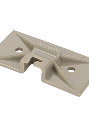 The AGCO Retainer - D45039300, crafted from durable plastic and distinguished by its beige color, features two screw holes and a center groove for secure component mounting. Reinforcement ridges enhance stability, although the full extent of its durable build has yet to be detailed in existing product descriptions.