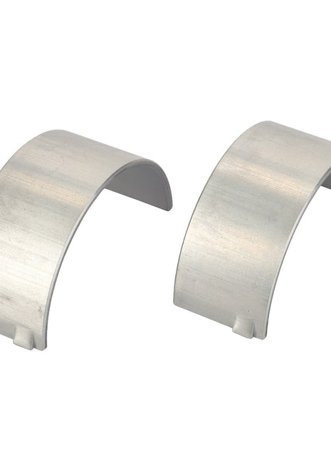 Currently, there is no detailed product description available, but visually, two silver semicircular metal brackets identified as the AGCO | Conrod Bearing - V836179784 are placed side by side on a pristine white background.