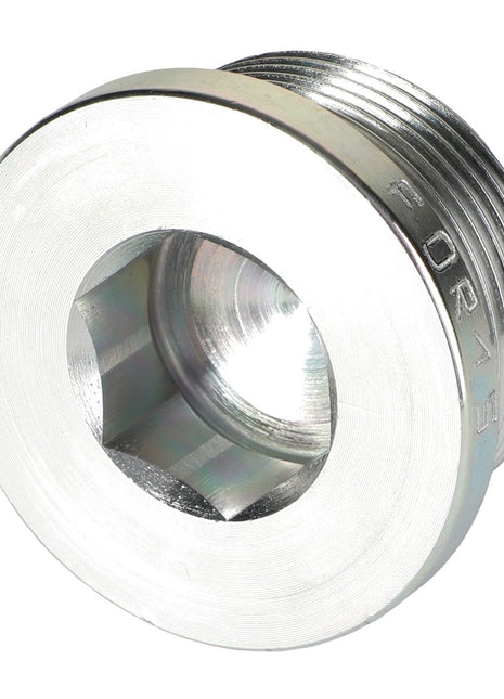 Close-up of the AGCO Plug Screw - Acw2095940, a silver hexagonal metal plug with threaded edges commonly used in hydraulic or plumbing systems. One side features a flat surface with an internal hexagonal socket, while the other side is threaded. No current product description information available for further details from AGCO.