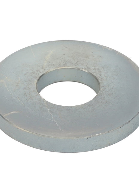 The AGCO Flat Washer - La300018047 is a silver metal washer with a central hole, typically used in assembly and construction to distribute the load of a threaded fastener like a screw or nut.