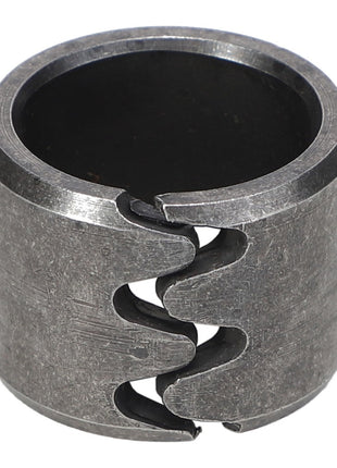 The AGCO Bearing Bush - Acp0018930 is a metal coupling with a split design, featuring serrated edges on both sides for a secure fit. No current product description available.