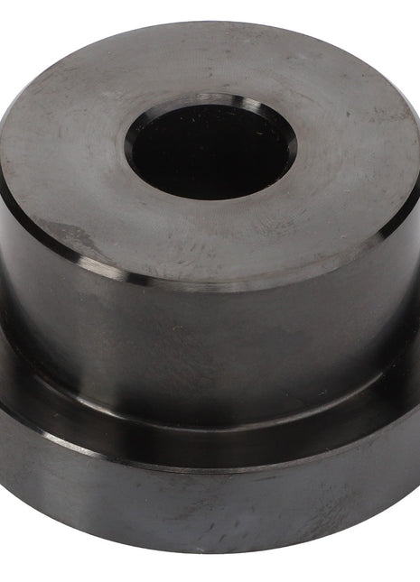 A cylindrical metal component with a central hole, resembling a mechanical part or spacer, called the AGCO | Tool - Acp0446460 by AGCO.