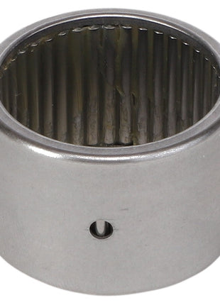 Close-up of a metallic AGCO Needle Roller Bearing (Model KS5045) with internal rollers visible and a hole on the outer casing. This high load capacity bearing, featuring a small cross-sectional area, appears to be unused.