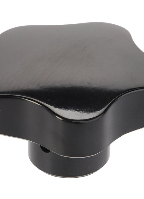 The AGCO Lever - D28751574 is a black, star-shaped knob with a central hole, commonly used for adjusting or securing mechanical equipment. Note that there is currently no additional product description information available.