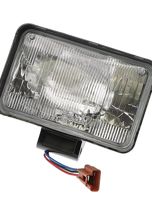 Introducing the AGCO | HEAD LIGHT - ACP0523400: a rectangular automotive headlight featuring a clear lens, black housing, and electric wiring with a brown connector. If you have any product questions, please contact our support team for assistance.