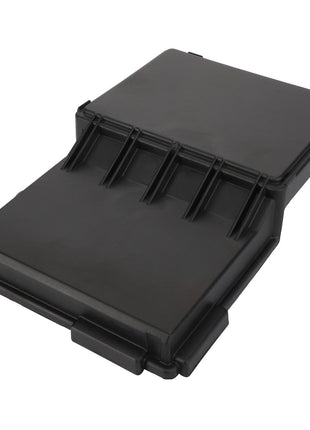 The AGCO Cover - Acw0316100 by AGCO is a sleek black plastic cover with a flat surface adorned with multiple grooves, combining functionality and style.