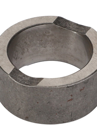 Close-up of the AGCO | Collar - Acp0137180, a cylindrical metal ring with a hollow center and two notches on the top edge. No current product description available.