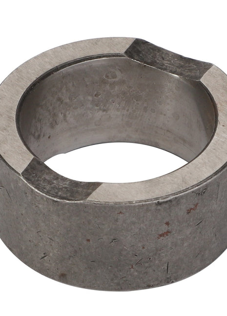 Close-up of the AGCO | Collar - Acp0137180, a cylindrical metal ring with a hollow center and two notches on the top edge. No current product description available.