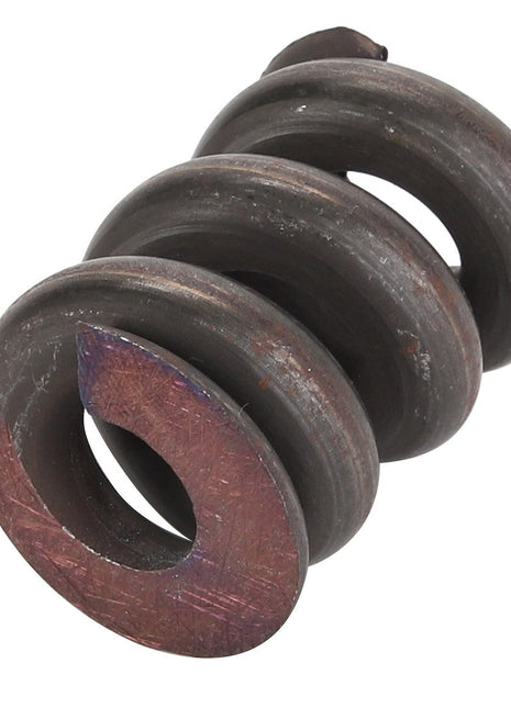 Close-up of the AGCO Spring - Acp0216550 by AGCO, showing its durable, coiled metal construction with a dark, worn surface and four visible loops, illustrating its rugged history.