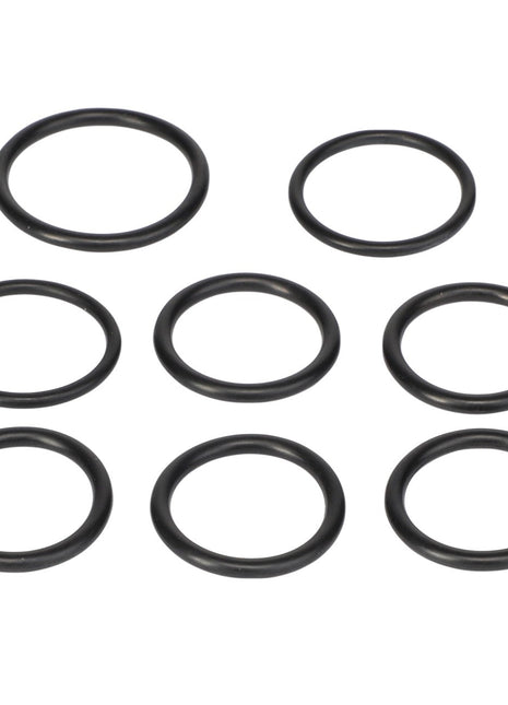 The AGCO SEAL KIT - F718100600010, featuring eight black rubber O-rings, is meticulously arranged in a circular pattern on a pristine white background, creating a striking visual contrast.