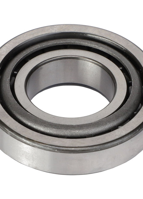 Close-up image of the AGCO Roller Bearing - Acp0360680 highlights its circular outer ring, inner ring, and multiple balls in between. This crucial component from AGCO is used in machinery to reduce friction and support both radial and axial loads.