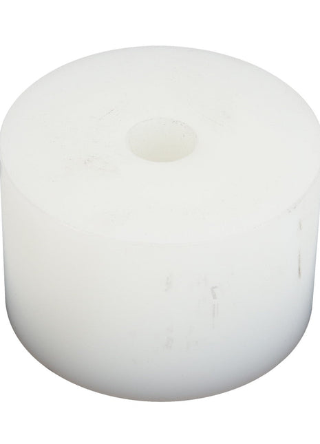 The AGCO PULLEY,TENSIONER - D26734742 by AGCO is a cylindrical, solid white object featuring a central hole, resembling either a large spool or an unglazed doughnut. Its surface appears smooth but exhibits minor blemishes or marks.