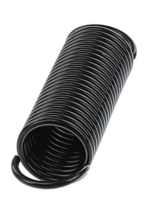 The AGCO Tension Spring - Acp0621470, a tightly coiled black metal spring with looped ends, rests horizontally on a stark white background.