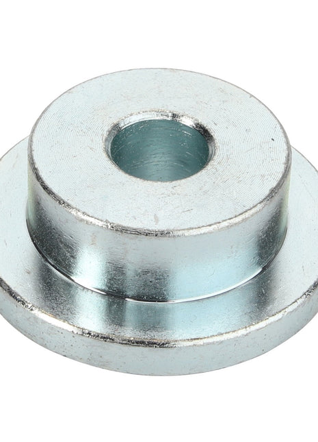 The AGCO | BUSH - D46150516 by AGCO is a metallic, cylindrical spacer with a central hole, designed in a conical shape that gracefully tapers from a wider base to a narrower top.