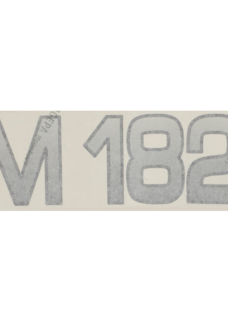 Clear film material displaying the text "M 182" in large outlined lettering. Product Name: AGCO | Decal - Fel142111, Brand Name: AGCO.
