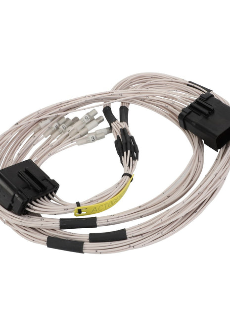 A coiled bundle of white AGCO electrical cables with black connectors and precisely labeled ends, known as the Harness - Act0065090.