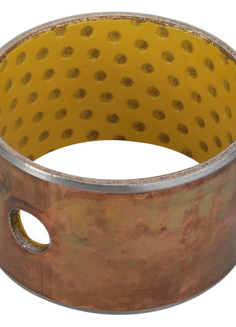 The AGCO Bushing for Front Loaders (Acp0294020) is a cylindrical metal component with a diameter of 45 mm and a length of 30 mm, featuring a yellow, perforated inner lining and a single hole on its outer surface.