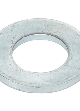 The AGCO washer, model AL5013107, features a central hole and a slightly worn surface.