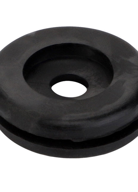 The AGCO | GROMMET - LA10396580 is a black rubber grommet featuring a central hole and a groove around its outer edge. More detailed product description information is currently unavailable.