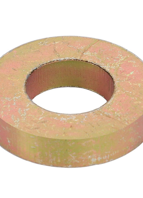A close-up of the AGCO | FLAT WASHER - D20400424, showcasing its circular metal form with a central hole and displaying a worn and slightly scratched surface. No current product description information is available for this item.