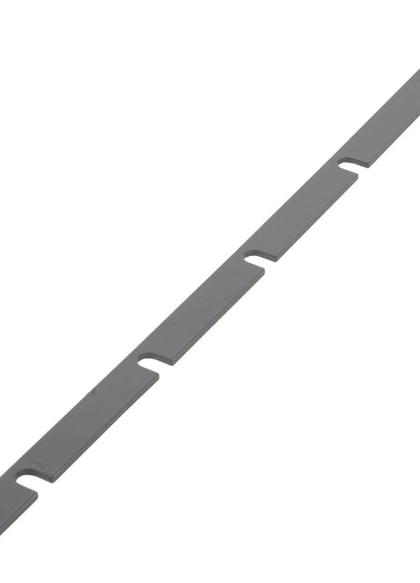The AGCO | Spacer - Acx0061000 is a long, thin metal strip featuring evenly spaced rectangular cutouts along its length. Unfortunately, no current product description information is available.