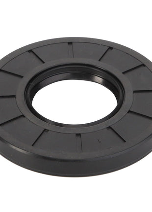 The AGCO | Oil Seal - Acp0443660 is a black, circular rubber gasket with an open center and radial grooves, designed to ensure reliability and performance in sealing and reducing friction in mechanical applications.