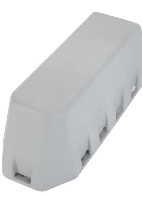The AGCO | CAP - AL5101096 by AGCO is a white, rectangular wheel chock designed to prevent vehicles from moving. No current product description information available.