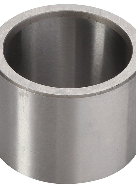 A sleek, cylindrical metal pipe segment with a hollow center and smooth surface, standing upright. Presenting the AGCO Spacer - Acp0445460 by AGCO.