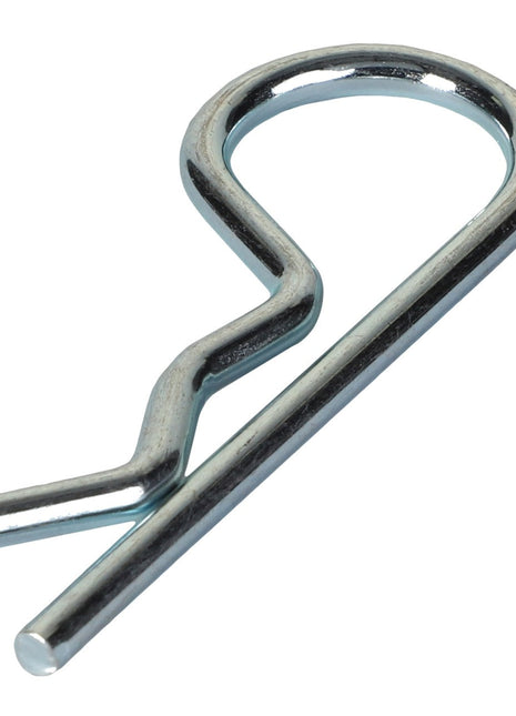 A close-up image of a silver AGCO Hair Pin Clip - Acp0014600, also known as a hitch pin clip, used for firmly securing the position of components.